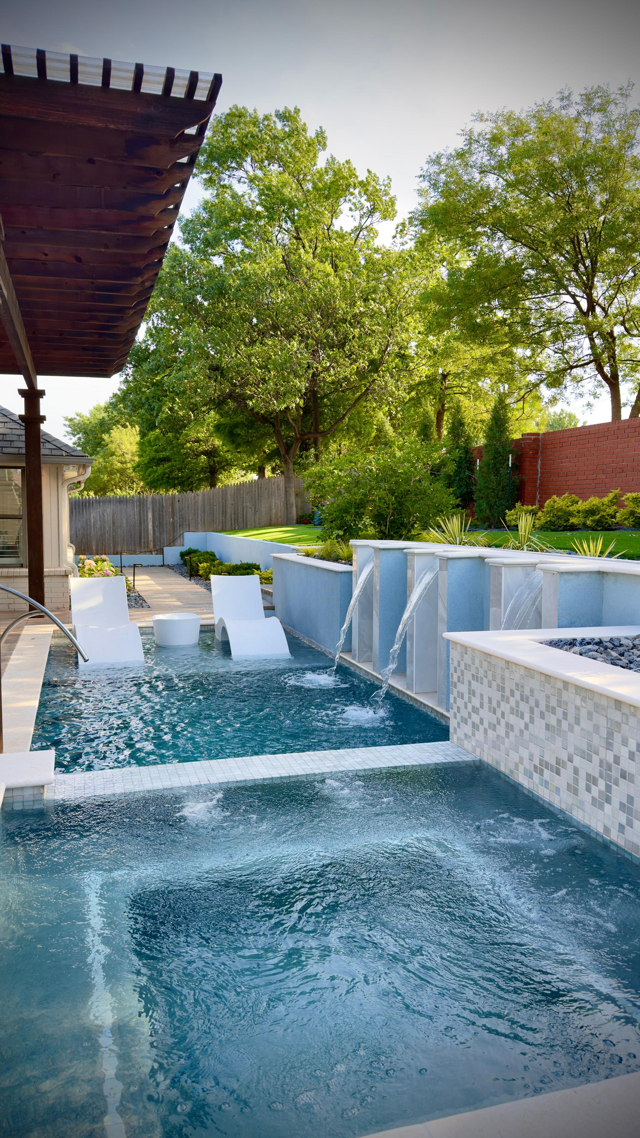 Resort-style pool and spa by Studio W
