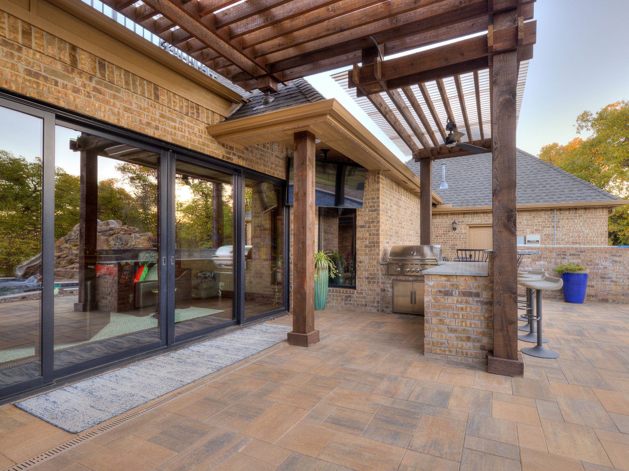 Coltrane Road outdoor kitchen with pergola and patio pavers