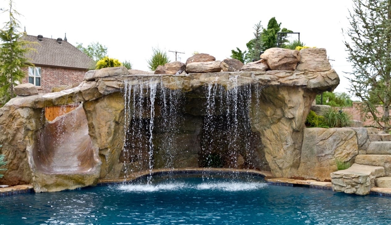 Grand grotto waterfall curtain with rock slide and stepping stones